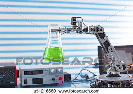 Robotic arm holding flask. View Large Photo Image Stock Image - Robotic arm holding flask.. Fotosearch