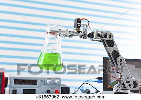Stock Image - Robotic arm holding flask.. Fotosearch
