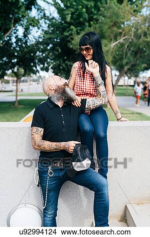 Picture - Romantic hipster couple in park, Valencia, Spain. Fotosearch