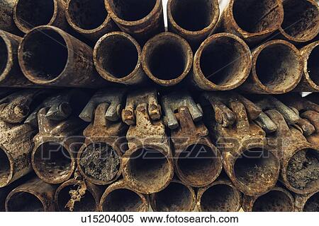 Rusty used scaffolding pipes on construction site. View Large Photo Image Stock Photography - Rusty used scaffolding pipes on construction site.. Fotosearch
