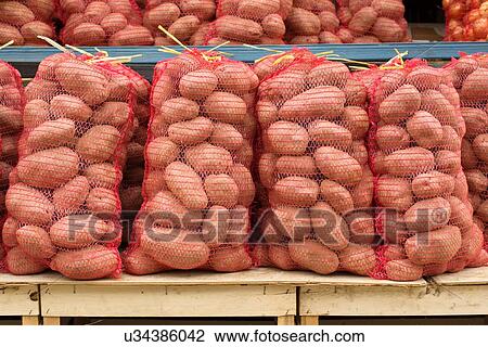 Stock Image - Sacks of potatoes.. Fotosearch