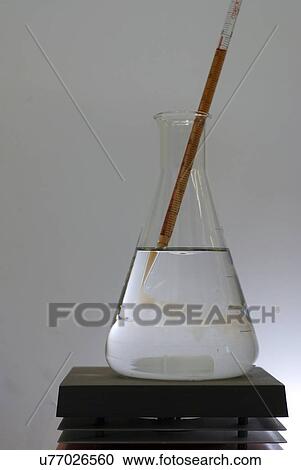 Sampling chemical compounds from a beaker with a pipette. View Large Photo Image Stock Image - Sampling chemical compounds from a beaker with a pipette.. Fotosearch