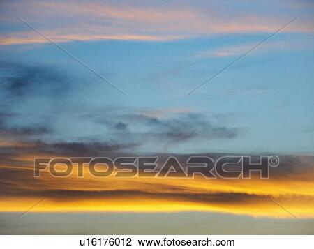 Stock Image - Scenic view of clouds against blue sky. Fotosearch