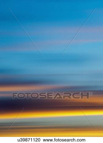 Stock Image - Scenic view of clouds against blue sky. Fotosearch