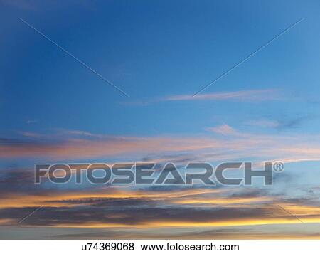 Stock Photo - Scenic view of clouds against blue sky. Fotosearch