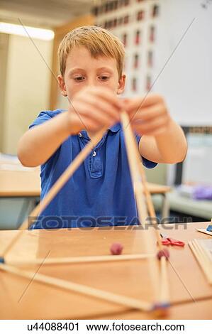 Schoolboy making ball and stick model in classroom at primary school View Large Photo Image Stock Image - Schoolboy making ball and stick model in classroom at primary school. Fotosearch
