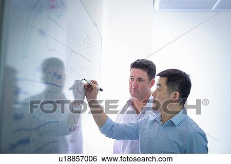 Scientists drawing on white board in meeting room View Large Photo Image Stock Photograph - Scientists drawing on white board in meeting room. Fotosearch