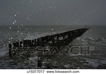 Seascape with snow at breakwater, Domburg, Zeeland, Netherlands View Large Photo Image Stock Photo - Seascape with snow at breakwater, Domburg, Zeeland, Netherlands. Fotosearch