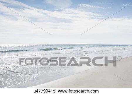 Stock Photography - Sky above sea and sandy beach. Fotosearch