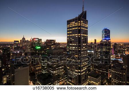 Skyscapers illuminated at sunset, Melbourne, Victoria, Australia View Large Photo Image Stock Photography - Skyscapers illuminated at sunset, Melbourne, Victoria, Australia. Fotosearch