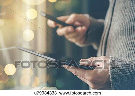 Smartphone and tablet data synchronization. View Large Photo Image Stock Image - Smartphone and tablet data synchronization.. Fotosearch