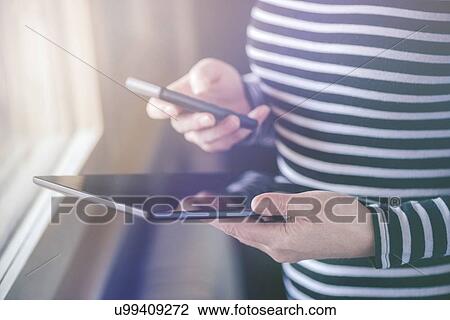 Smartphone and tablet data synchronization. View Large Photo Image Stock Image - Smartphone and tablet data synchronization.. Fotosearch