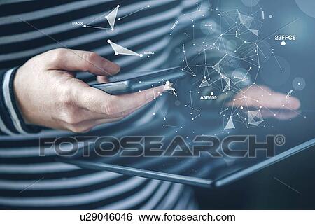 Smartphone and tablet data synchronization. View Large Photo Image Stock Photograph - Smartphone and tablet data synchronization.. Fotosearch
