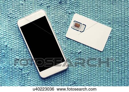 Stock Photograph - Smartphone with blank screen and SIM card.. Fotosearch