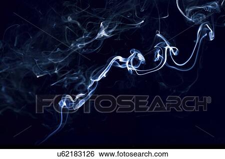 Stock Photograph - Smoke against black background.. Fotosearch