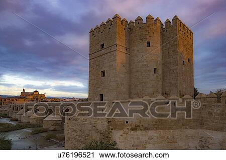 Stock Image - Spain, Andalusia, Cordoba, Facade of old church near bridge over Guadalquivir river. Fotosearch