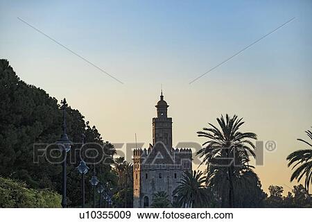 Stock Photo - Spain, Andalusia, Seville, Torre del Oro at dawn. Fotosearch