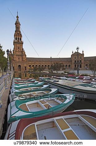 Spain, Seville, Boats floating on pond next to Plaza De Espana View Large Photo Image Stock Image - Spain, Seville, Boats floating on pond next to Plaza De Espana. Fotosearch