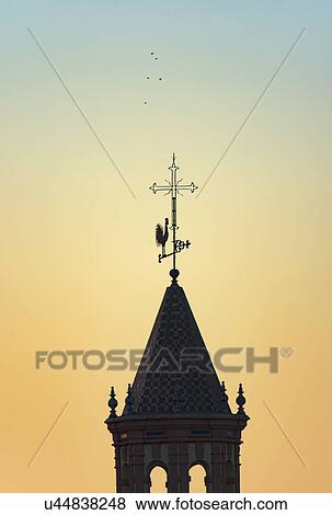 Stock Photo - Spain, Seville, Silhouette of Church bell tower. Fotosearch