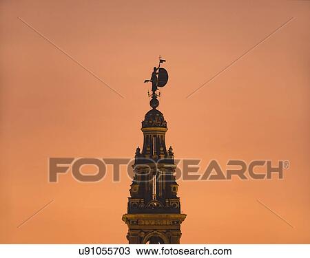 Stock Image - Spain, Seville, Silhouette of Giralda tower. Fotosearch