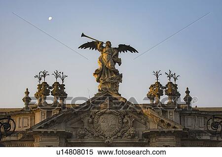 Stock Photography - Spain, Seville, Statue of angel with trumpet. Fotosearch