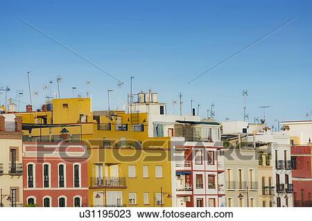 Stock Image - Spain, Seville, Triana, Colorful residential buildings. Fotosearch