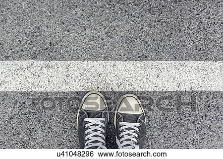 Standing at a border line, conceptual image. View Large Photo Image Stock Photograph - Standing at a border line, conceptual image.. Fotosearch
