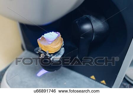 Stock Photograph - Still life of false teeth on dental equipment. Fotosearch