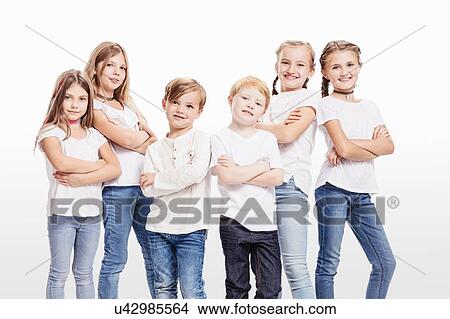 Studio portrait of two boys and four girls posing with arms folded View Large Photo Image Picture - Studio portrait of two boys and four girls posing with arms folded. Fotosearch