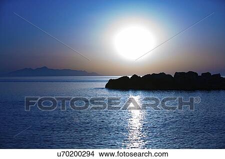 Picture - Sunset over calm sea.. Fotosearch