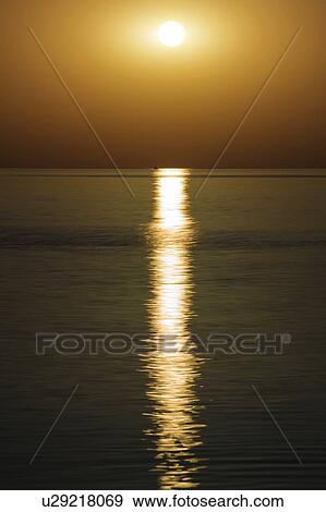 Sunset over calm sea. View Large Photo Image Stock Photo - Sunset over calm sea.. Fotosearch