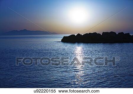 Sunset over calm sea. View Large Photo Image Stock Photography - Sunset over calm sea.. Fotosearch