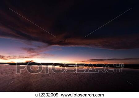 Sunset over Laguna Chaxa, Los Flamencos National Reserve, Salar de Atacama, Atacama Desert, Chile View Large Photo Image Stock Photo - Sunset over Laguna Chaxa, Los Flamencos National Reserve, Salar de Atacama, Atacama Desert, Chile. Fotosearch