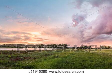 Sunset over rural landscape, Montana, US View Large Photo Image Stock Image - Sunset over rural landscape, Montana, US. Fotosearch