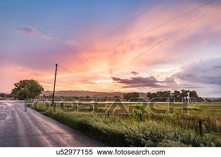 Sunset over rural landscape, Montana, US View Large Photo Image Stock Photography - Sunset over rural landscape, Montana, US. Fotosearch