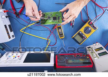 Stock Image - Testing circuit board.. Fotosearch