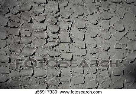 Stock Image - Textured grey cement wall. Fotosearch