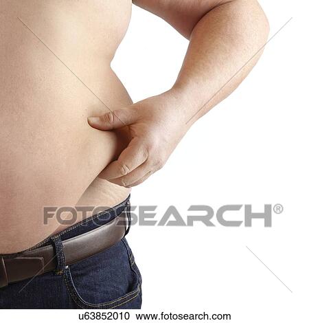 Stock Image - Topless overweight man holding the fat around his waist.. Fotosearch