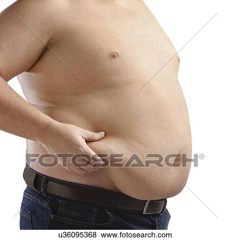 Stock Photo - Topless overweight man holding the fat around his waist.. Fotosearch