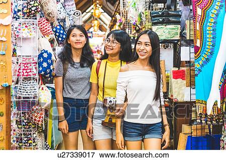 Tourists walking in bazaar, Bangkok, Thailand View Large Photo Image Stock Photo - Tourists walking in bazaar, Bangkok, Thailand. Fotosearch