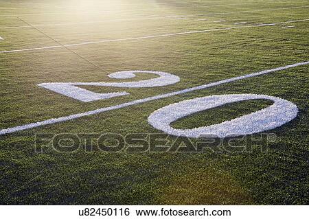 Twenty yard line on green playing field View Large Photo Image Stock Photograph - Twenty yard line on green playing field. Fotosearch