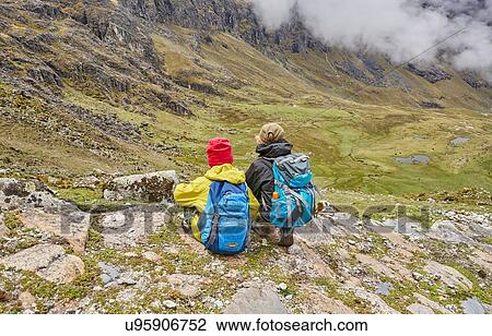 Two boys sitting on hillside, looking at view, rear view, Ventilla, La Paz, Bolivia, South America View Large Photo Image Stock Image - Two boys sitting on hillside, looking at view, rear view, Ventilla, La Paz, Bolivia, South America. Fotosearch