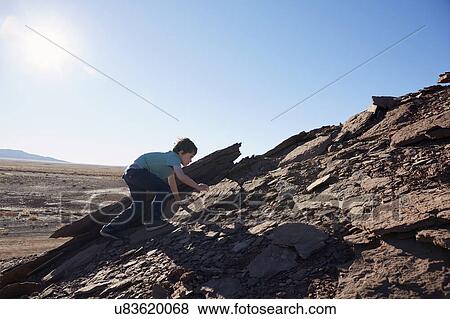 USA, Arizona, Boy (6-7) moving up on rock View Large Photo Image Stock Photo - USA, Arizona, Boy (6-7) moving up on rock. Fotosearch