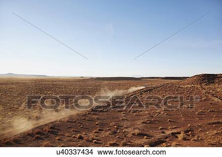 USA, Arizona, Dust left after pick up truck passing through desert View Large Photo Image Picture - USA, Arizona, Dust left after pick up truck passing through desert. Fotosearch