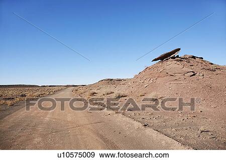 Stock Photo - USA, Arizona, Empty road through desert landscape. Fotosearch