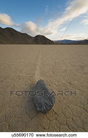 Stock Image - USA, California, Death Valley National Park, Race track Playa, Stones moving on desert. Fotosearch