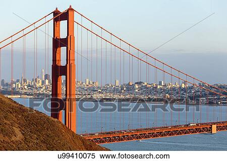 Stock Photography - USA, California, San Francisco, Golden Gate Bridge with city skyline in background. Fotosearch