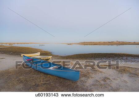 USA, Massachusetts, Cape Cod, Eastham, Blue canoe on beach View Large Photo Image Stock Image - USA, Massachusetts, Cape Cod, Eastham, Blue canoe on beach. Fotosearch