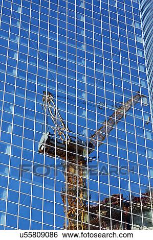 USA, New York, New York City, Crane reflecting in glass wall View Large Photo Image Stock Photograph - USA, New York, New York City, Crane reflecting in glass wall. Fotosearch