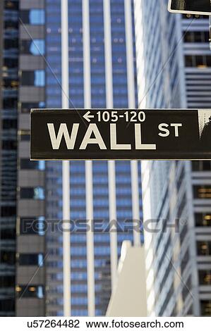 Stock Image - USA, New York, New York City, Lower Manhattan, Wall Street sign on building. Fotosearch
